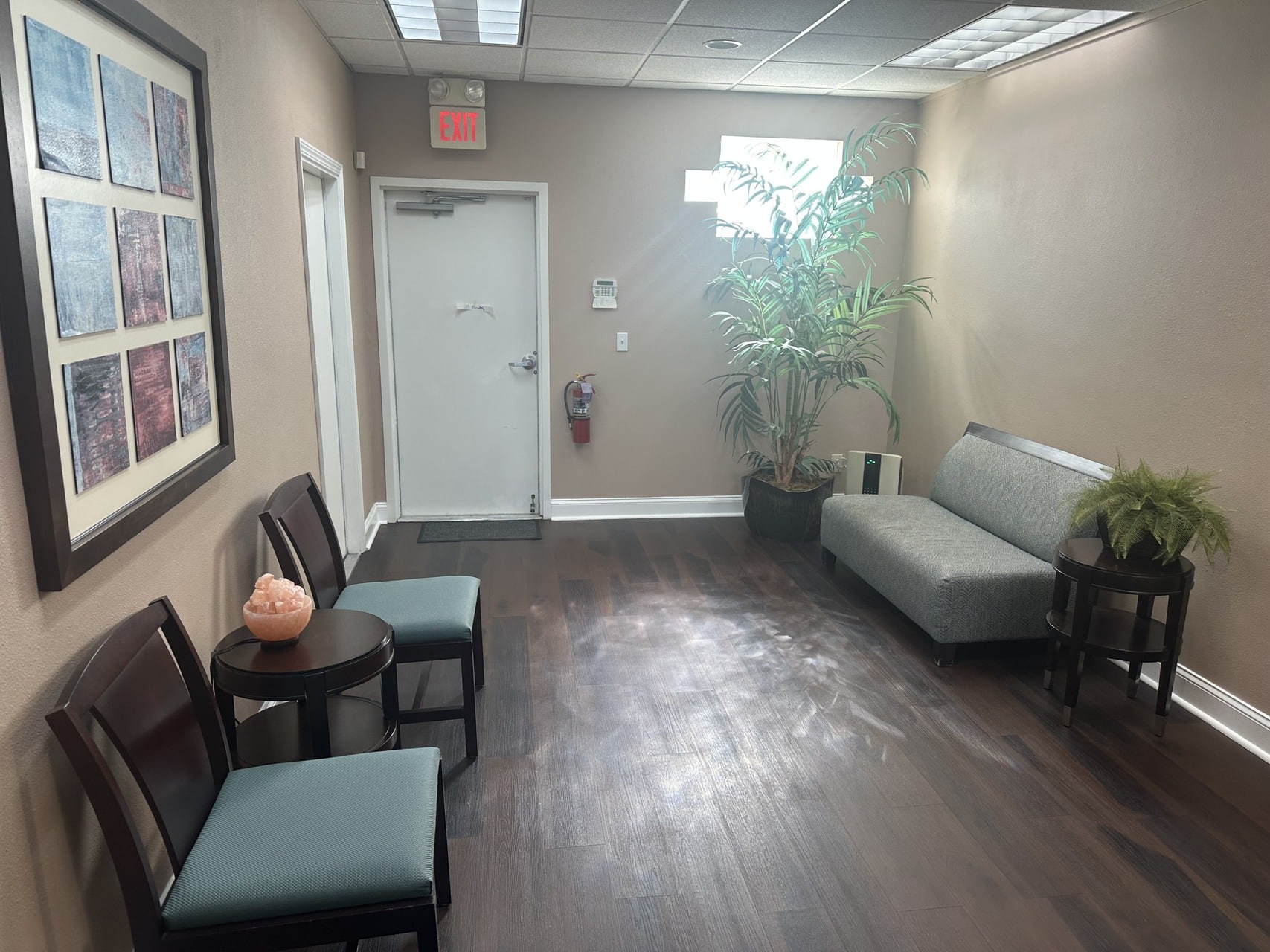 FX-405 red laser pain relief treatment room at Dr. Lara Weight Loss & Wellness — Erchonia laser apparatus positioned over treatment table